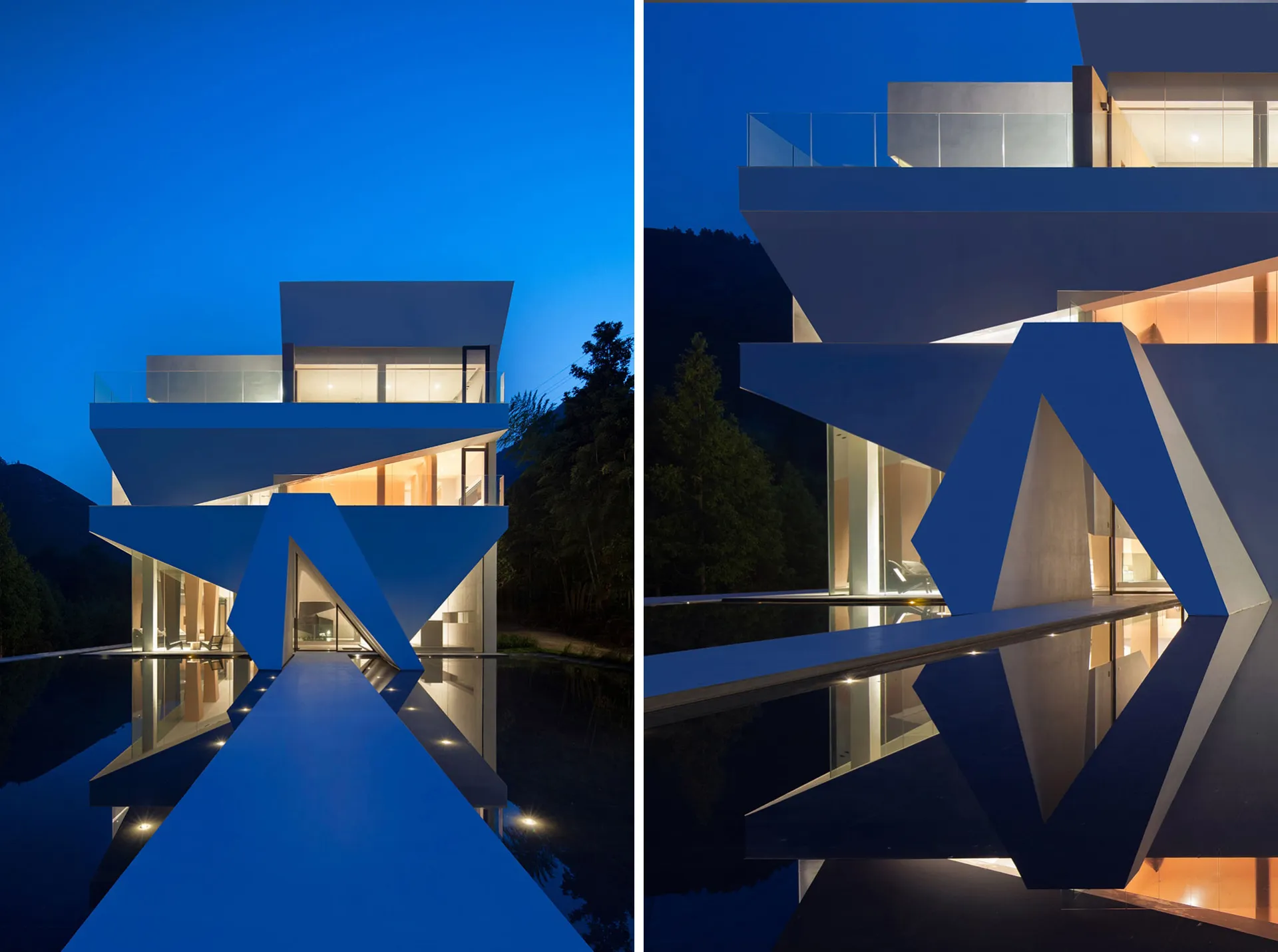 Contemporary house with glass walls and cement structure reflected in water at dusk.