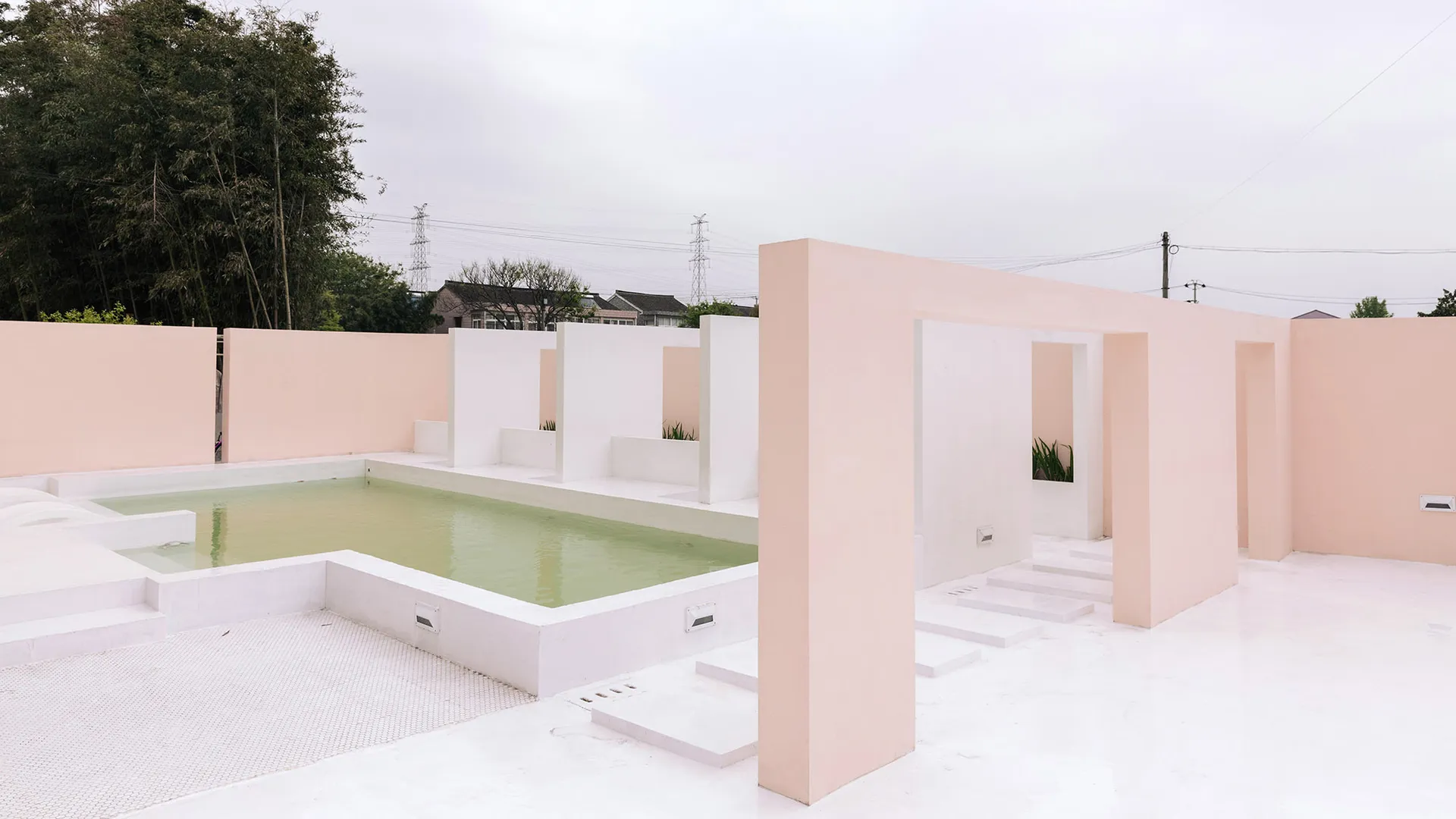 A minimalist swimming pool space constructed with concrete.