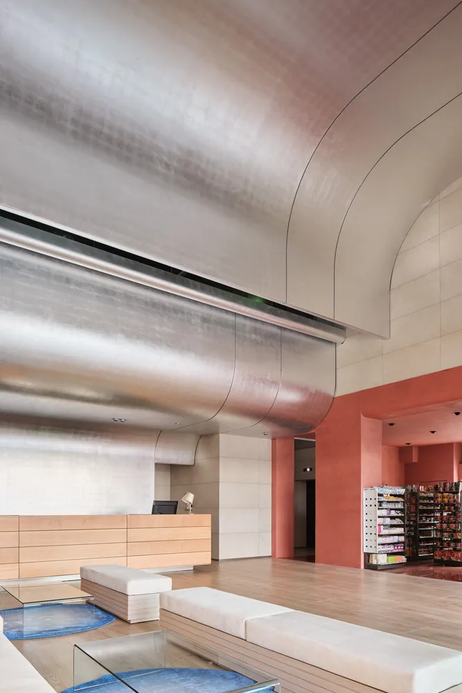 Modern retail storefront featuring sleek glass and concrete materials.