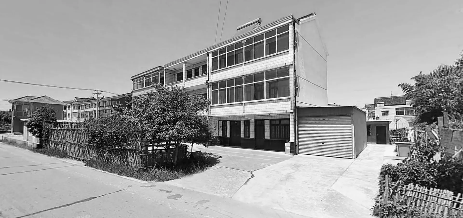 Modern building facade with large glass windows and concrete material