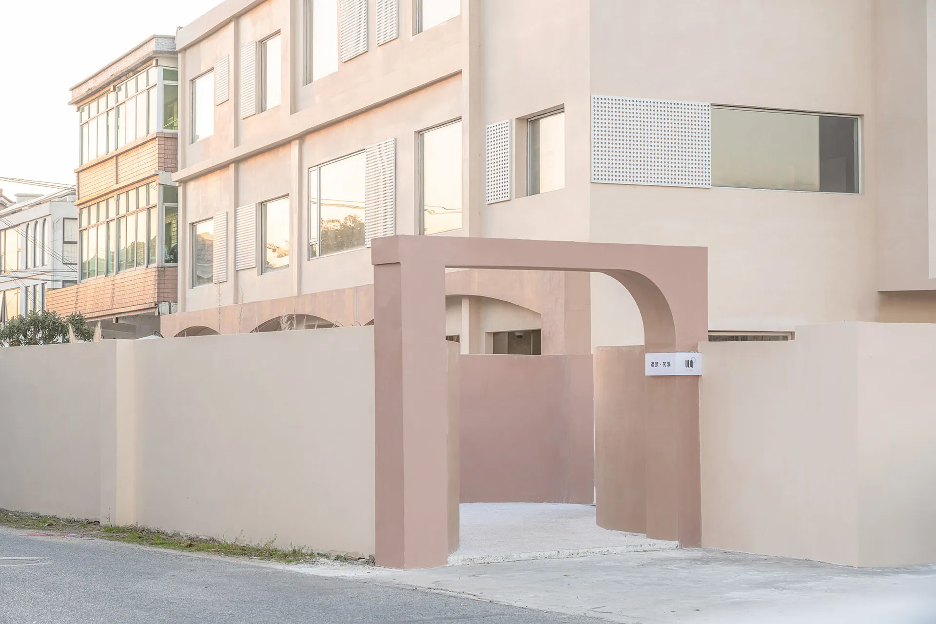 Modern building exterior with minimalist design and neutral concrete color