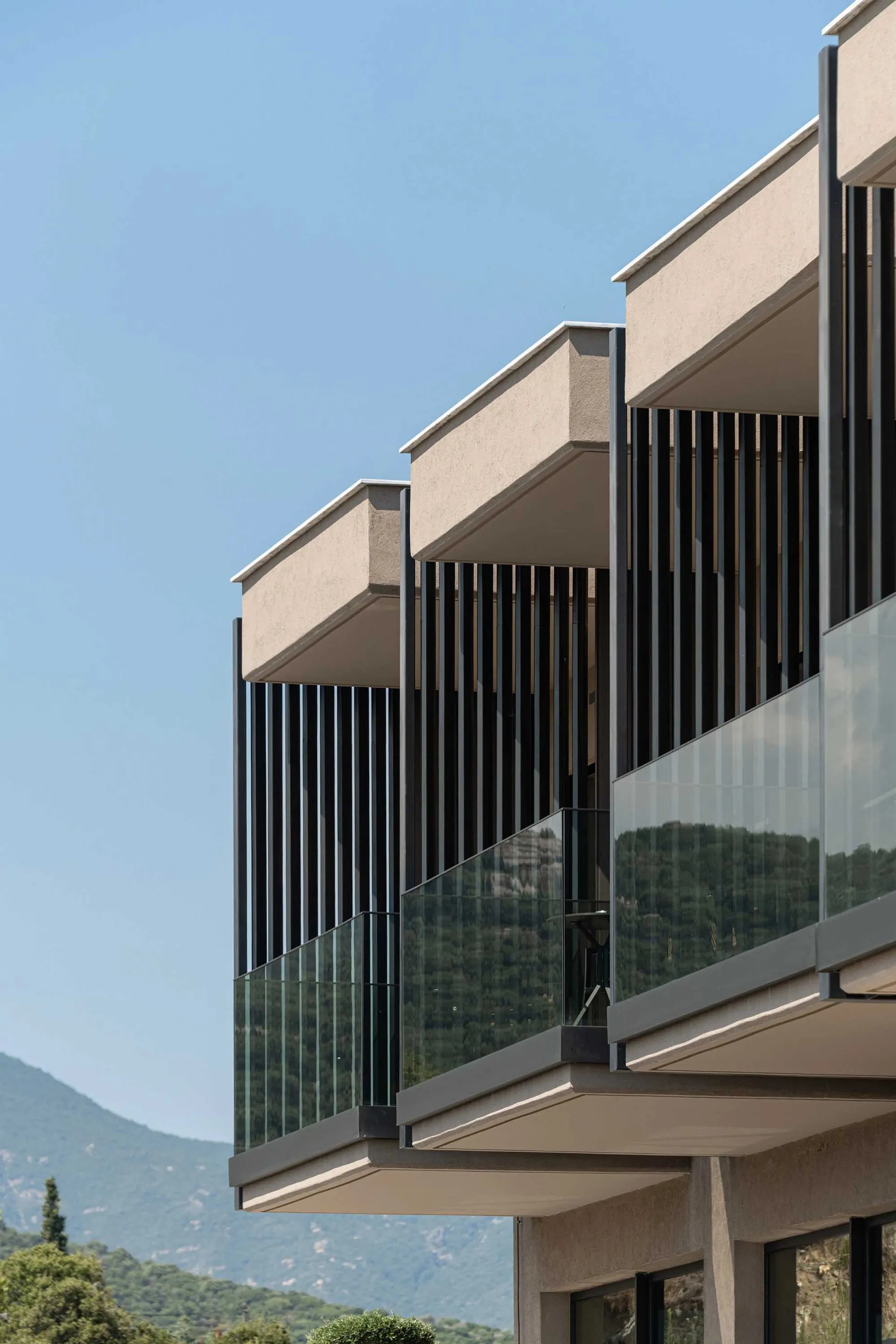 A modern building with glass and concrete exteriors.