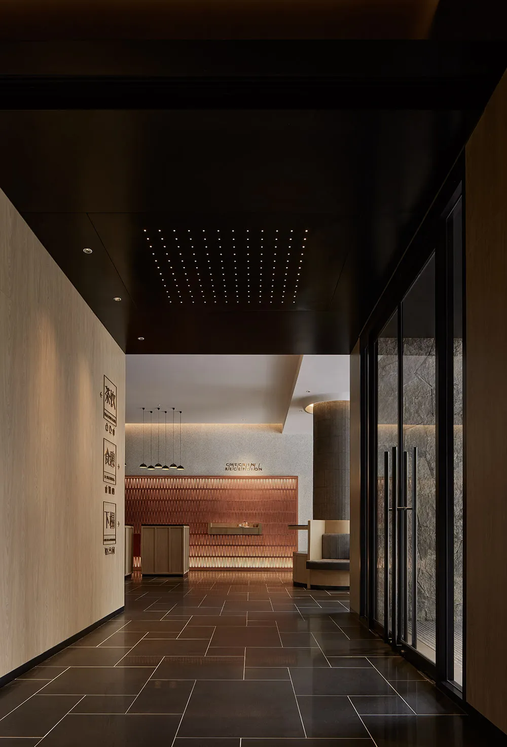 Modern lobby interior with concrete walls and glass walls and doors