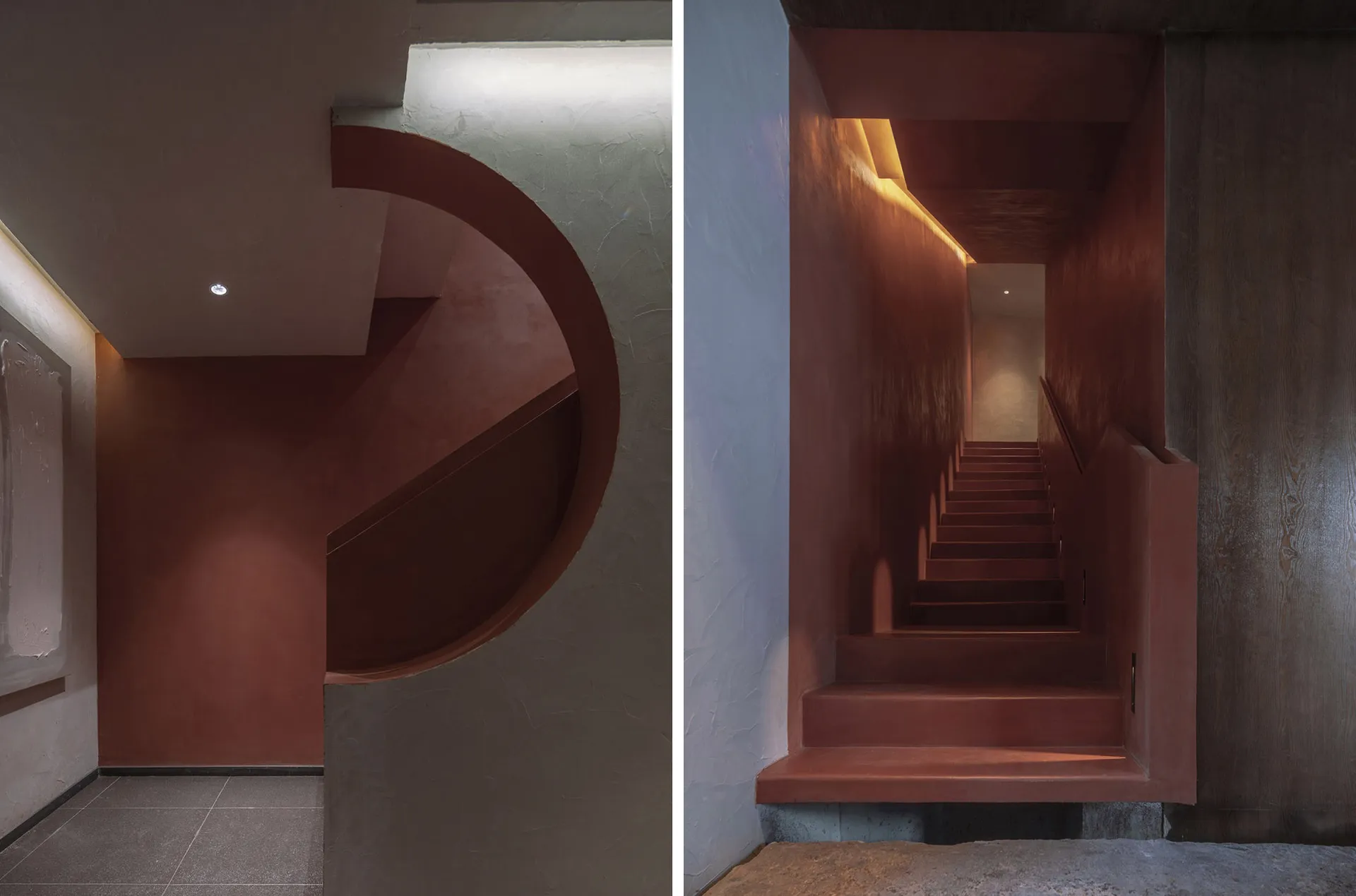 A modern concrete staircase with warm lighting and a minimalist design.