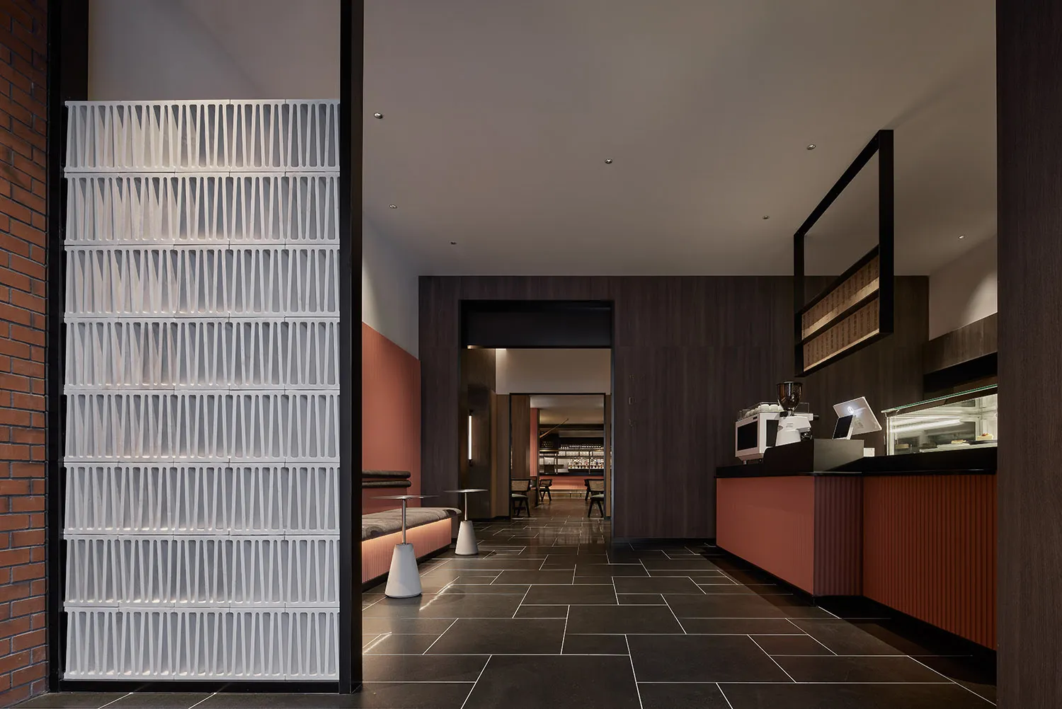 Concrete tiles and wooden elements in a restaurant interior design.
