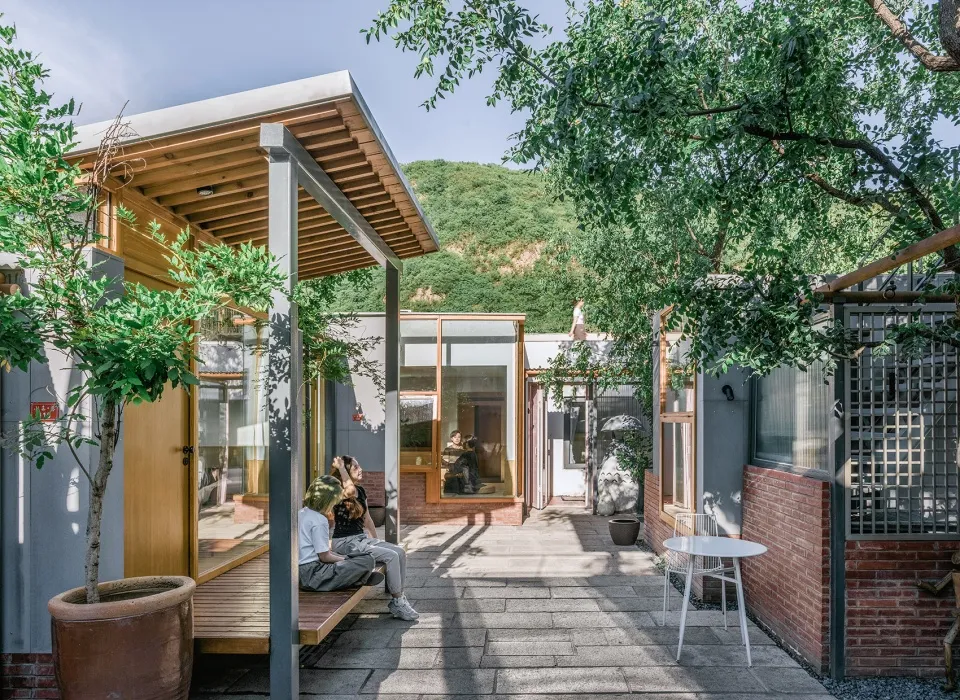 A modern residential space featuring a mix of wooden and concrete materials and high-tech design elements.
