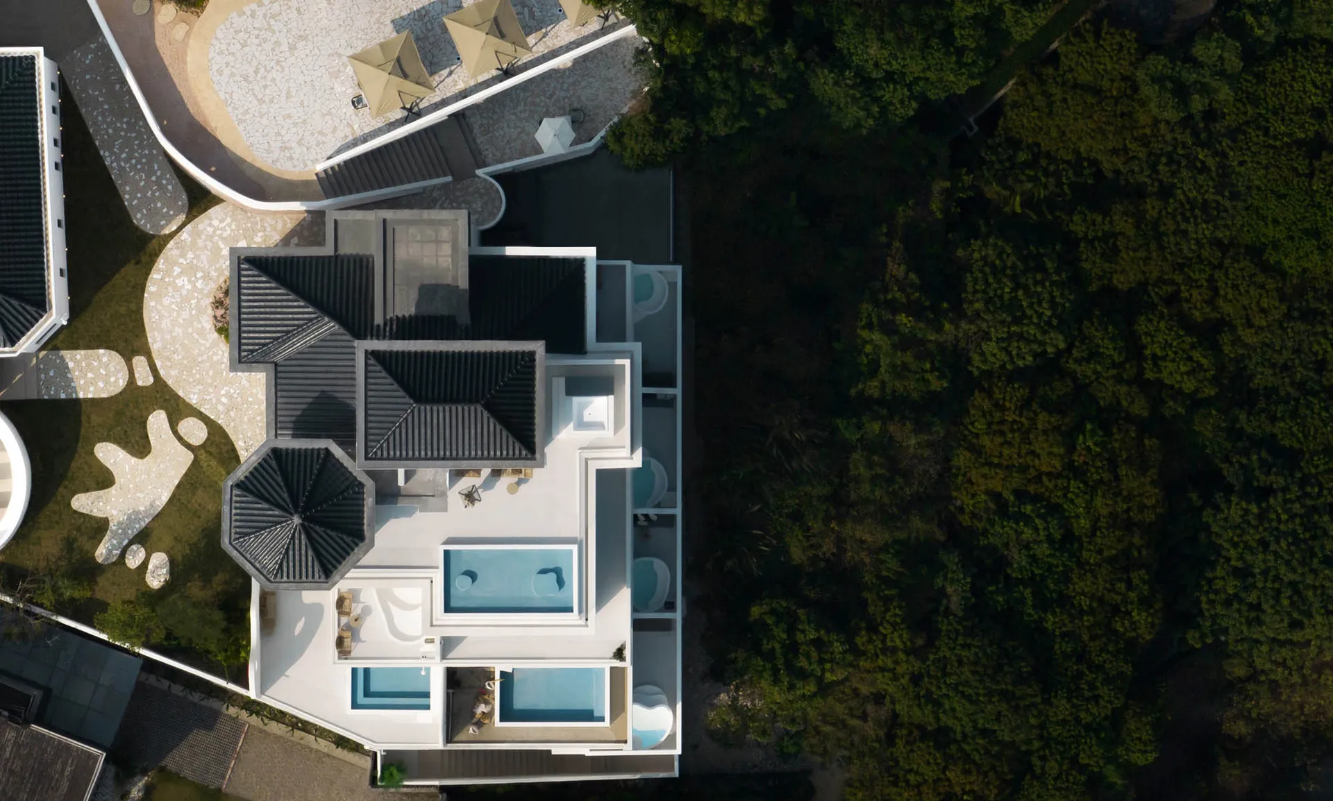 Modern villa with concrete floors and minimalist design.
