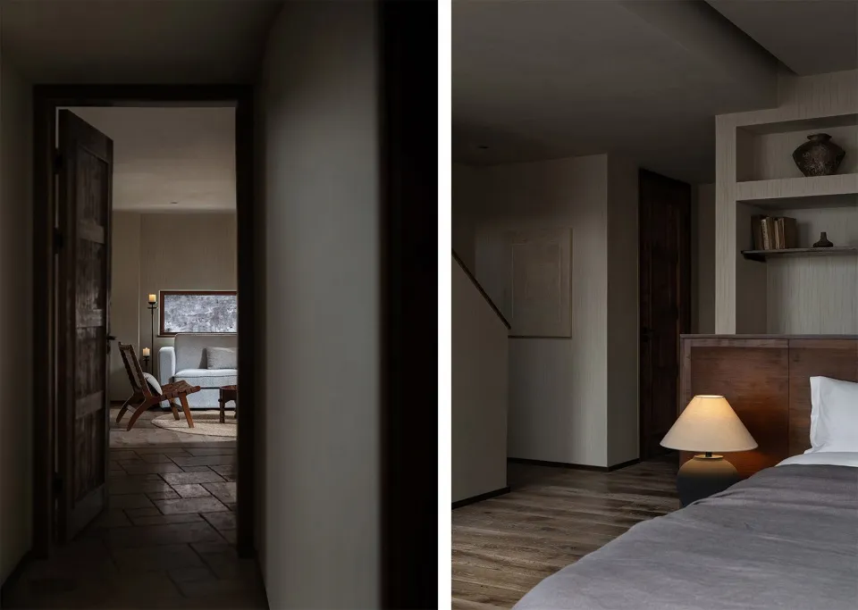 A minimalist bedroom with wooden furnishings and a soft glow from the lamp.