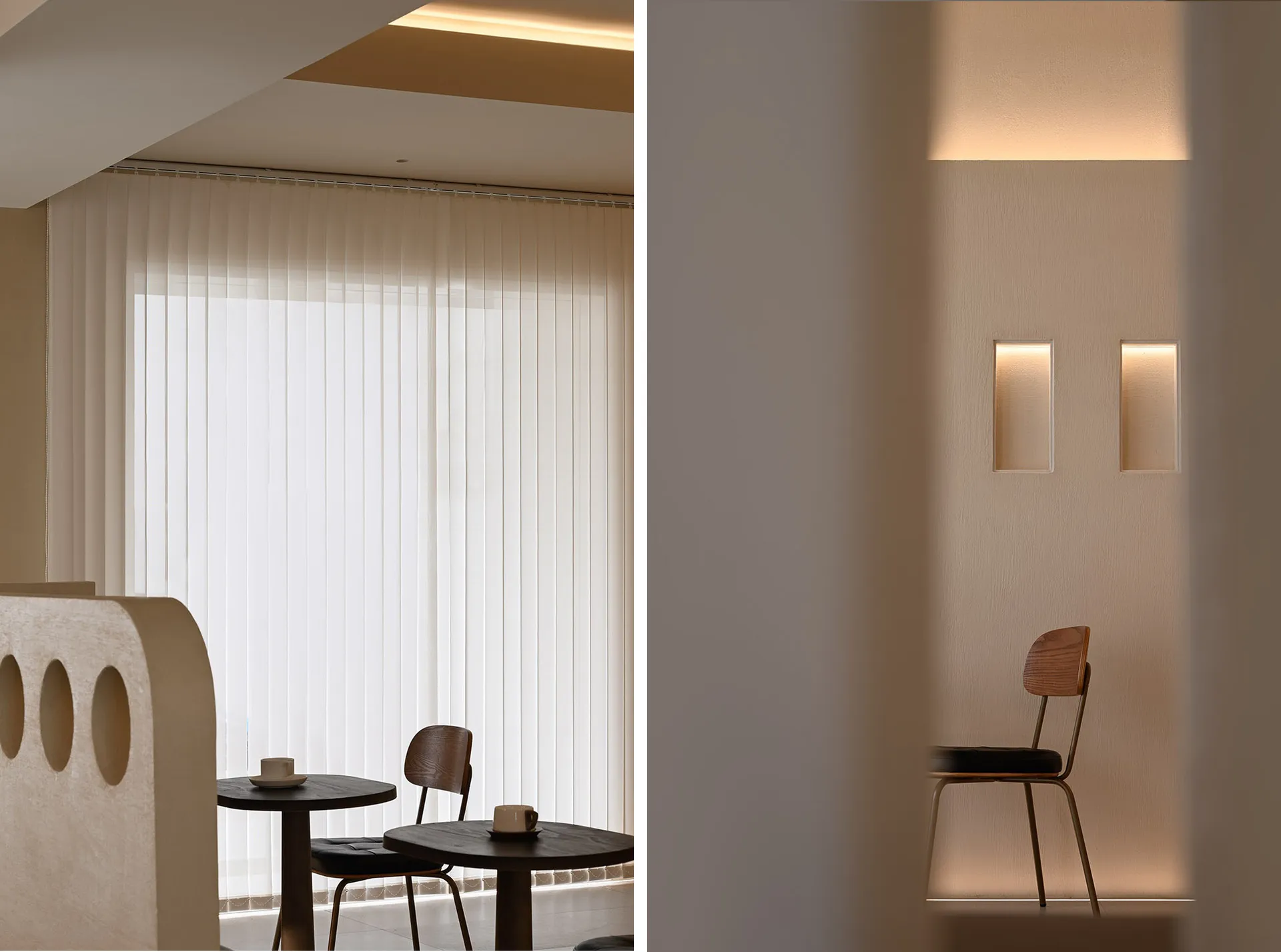 A minimalist coffee shop with neutral-toned lighting, featuring two small round tables and chairs.