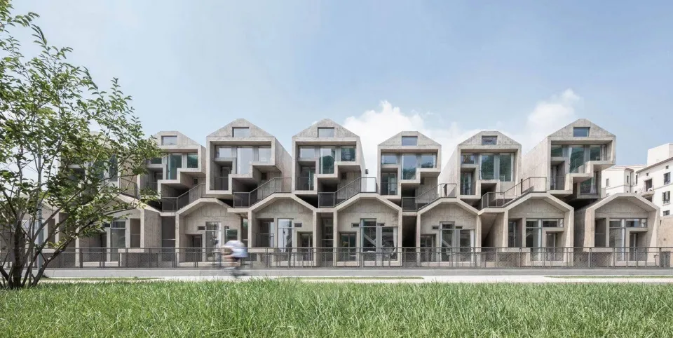 Modern buildings with concrete exteriors and geometric shapes.