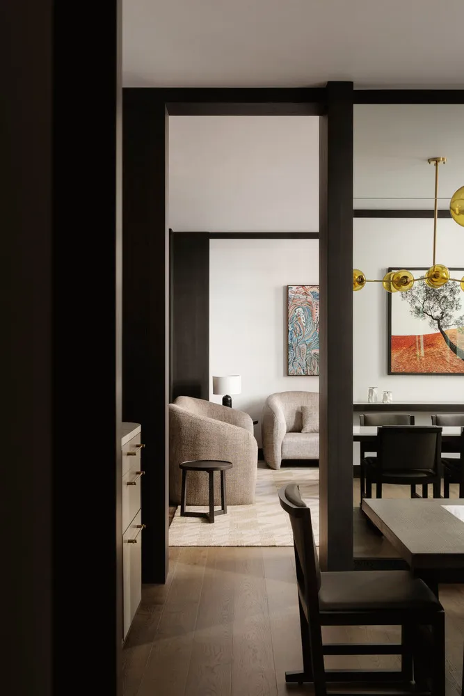 A modern living room with neutral-colored furnishings and minimalist design.