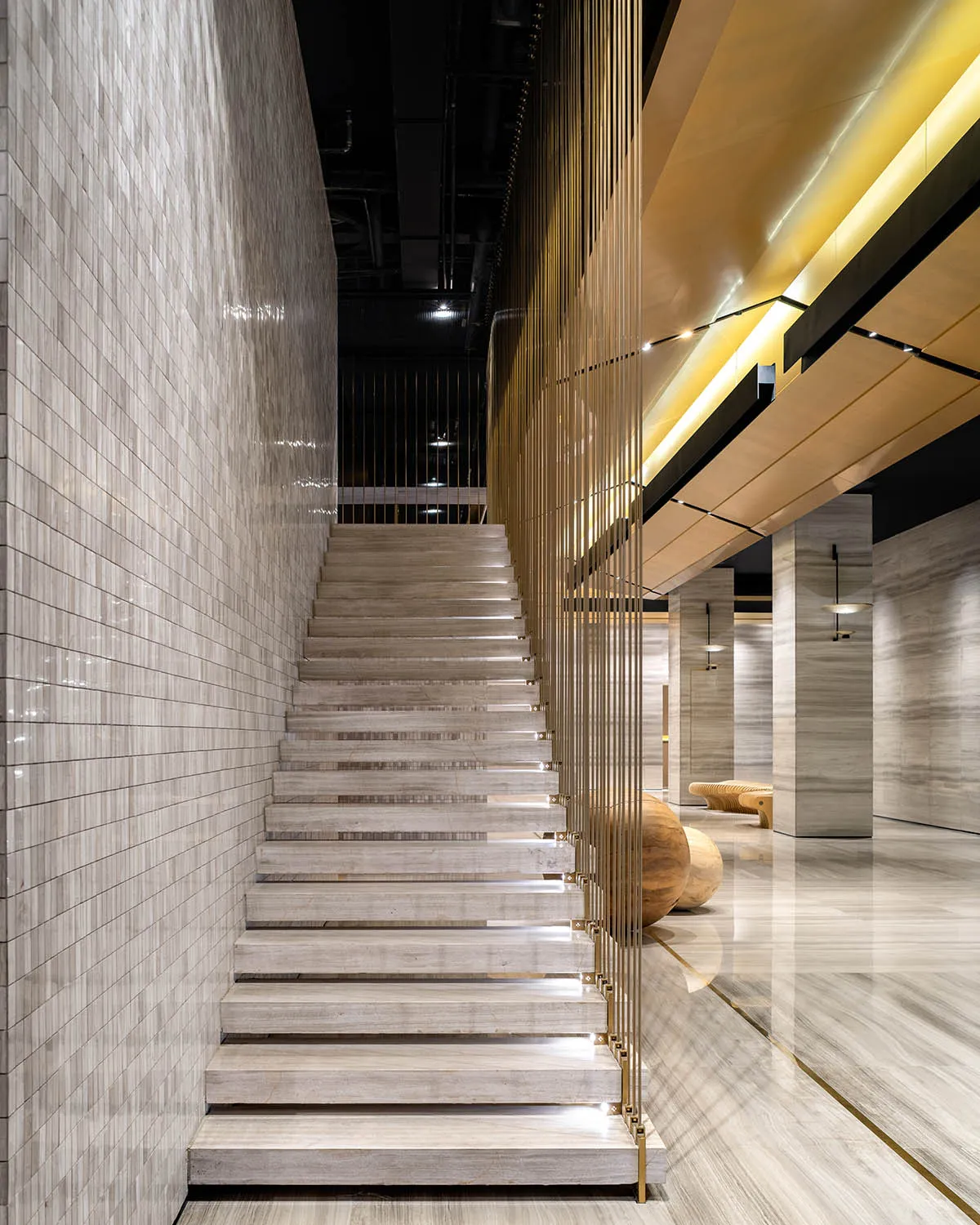 Modern minimalist staircase with concrete steps and white walls.