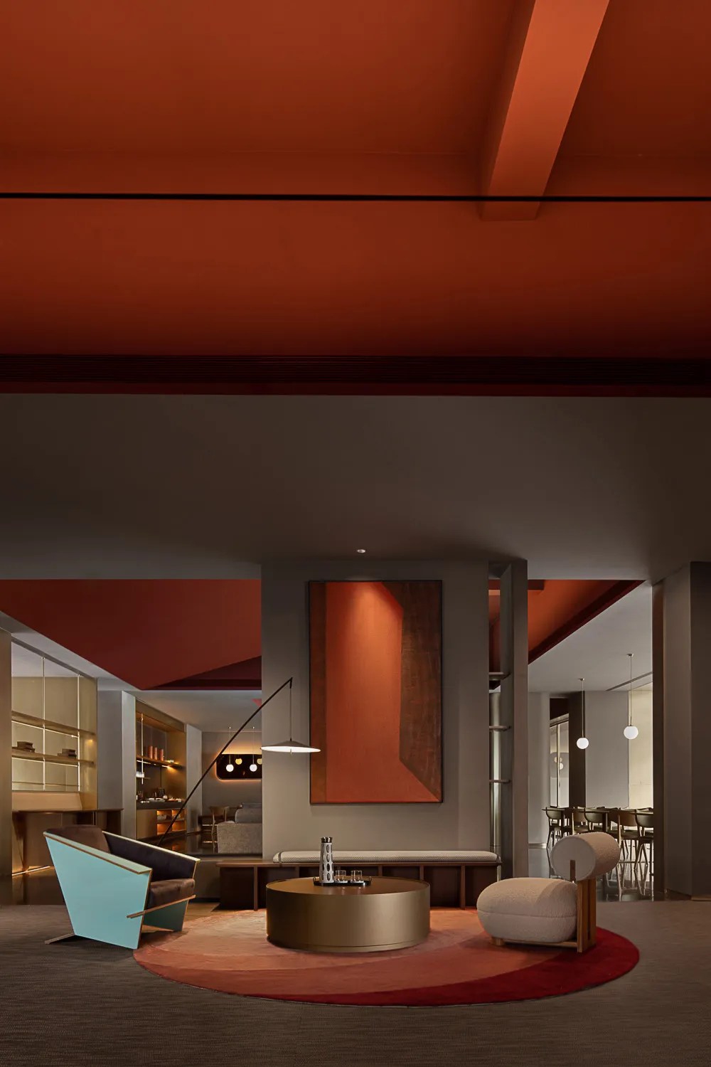 A modern lobby with metallic furniture and wooden elements.