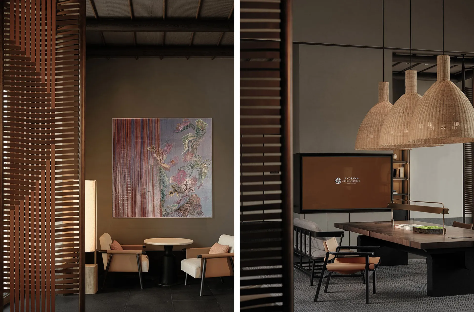 A minimalist hotel lobby features a wooden table, chairs, and a hanging rattan light fixture.