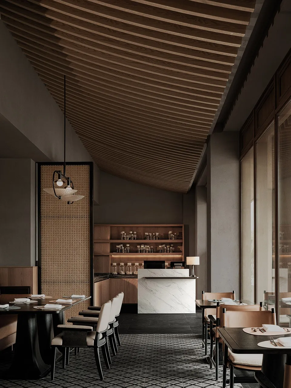 Modern restaurant interior featuring a marble counter and wooden ceiling beams.