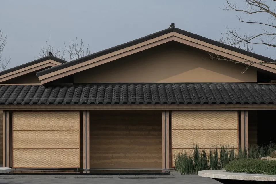 A traditional Chinese pavilion with bamboo window shutters and clay tile roofing