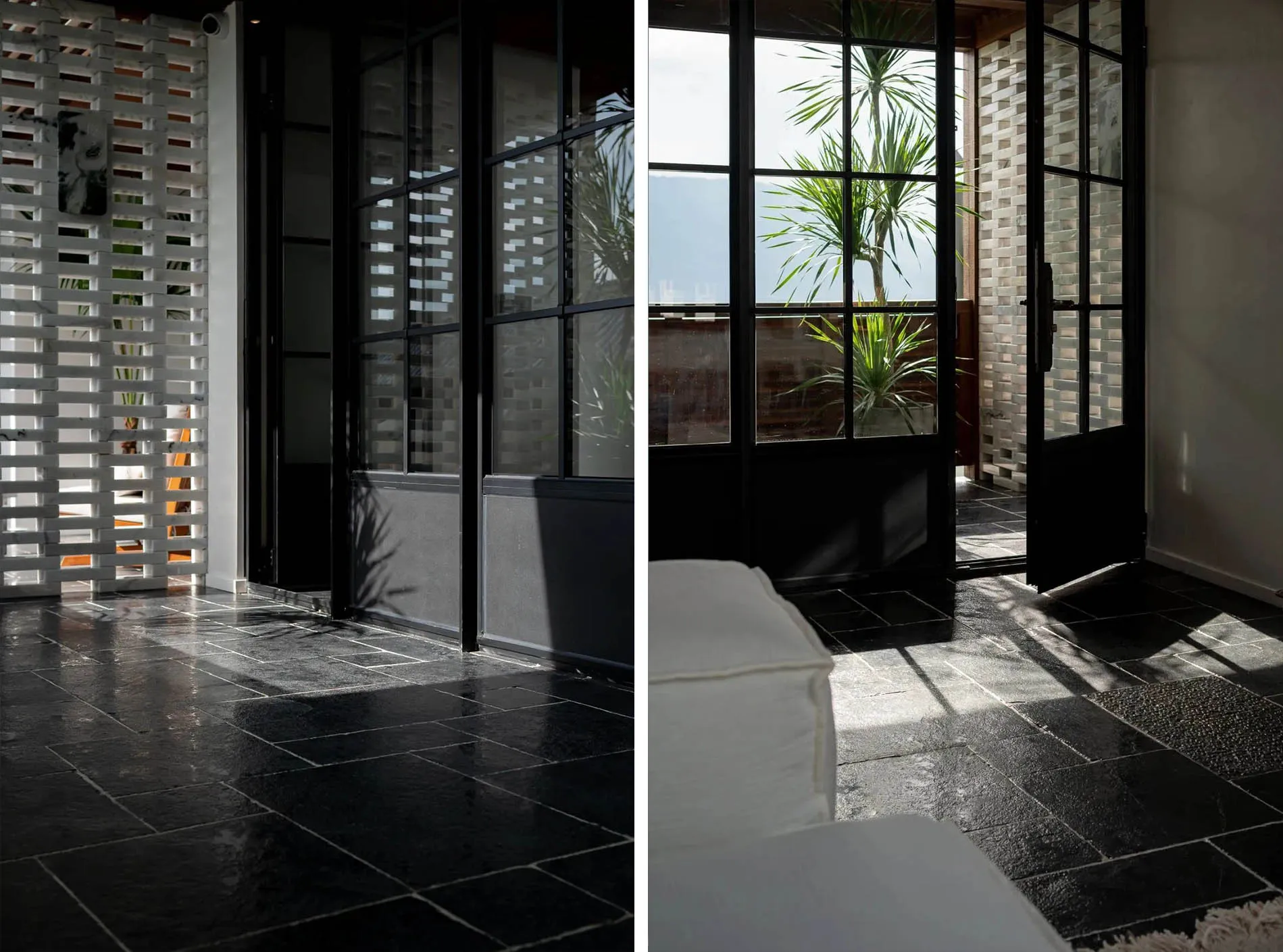 Modern living room with concrete flooring and large windows.