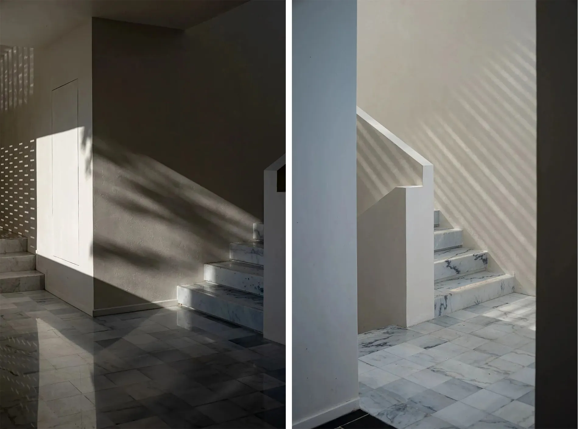 A minimalist modern interior featuring marble steps and walls with shadows from sunlight streaming through windows.