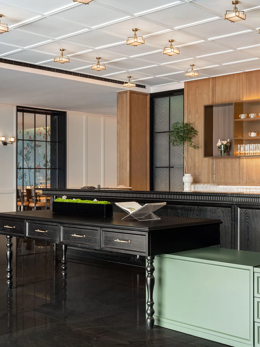 A modern restaurant bar with wooden elements and glass fixtures.