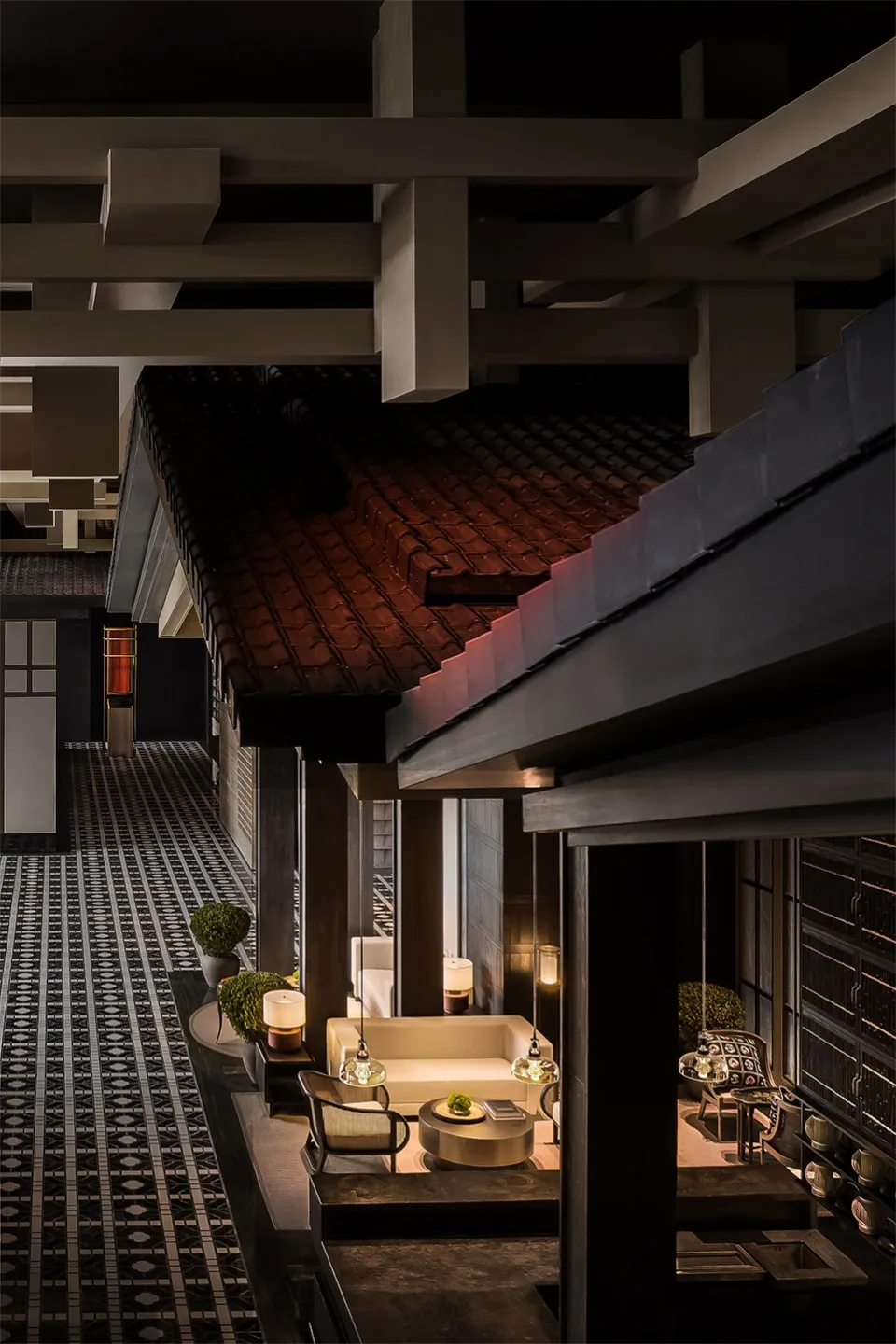 A modern industrial-style lobby with concrete flooring and minimalist decor.