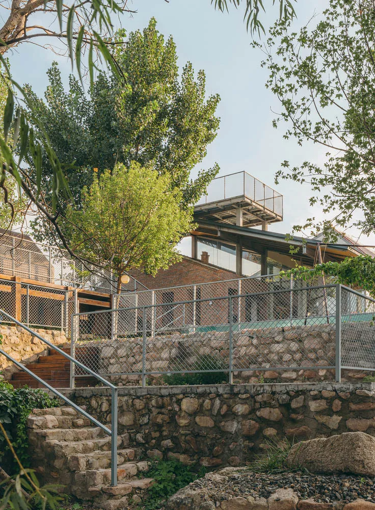 Modern architecture featuring stone and metal materials.