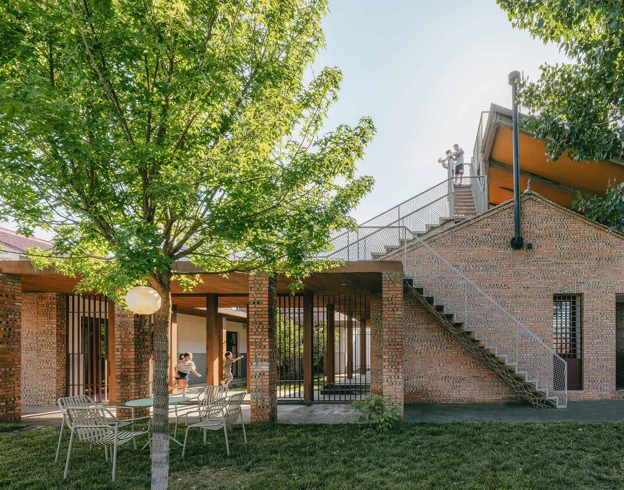A modern exterior with brick and metal structural elements.