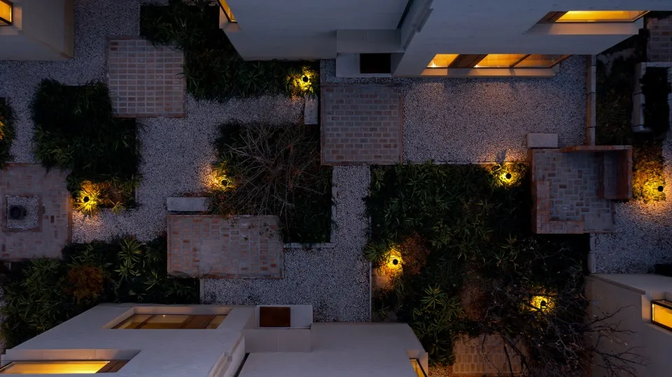 Top view of a modern industrial living space with concrete walls and floor.