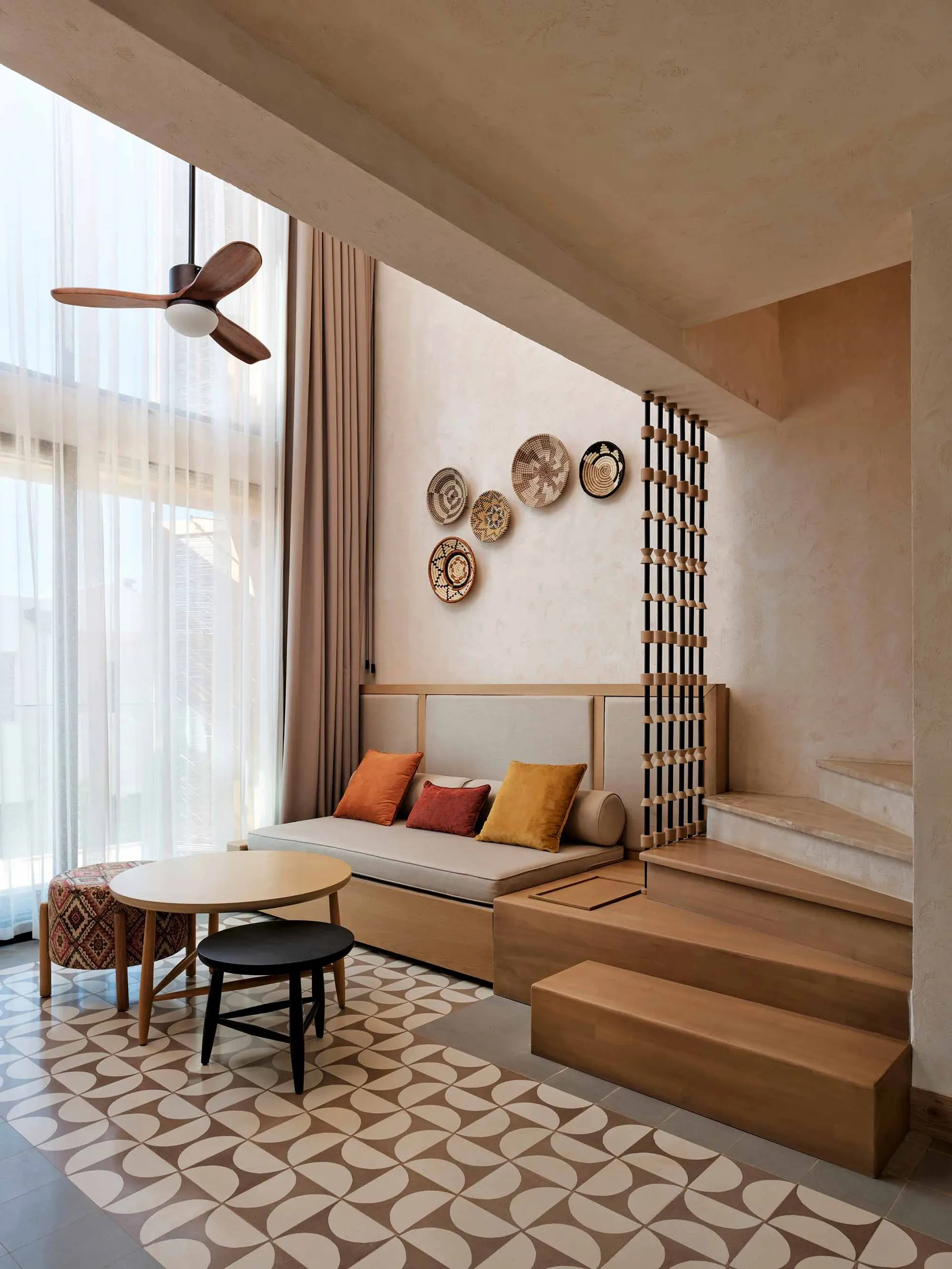 Modern living room with wooden furniture and decorative elements.