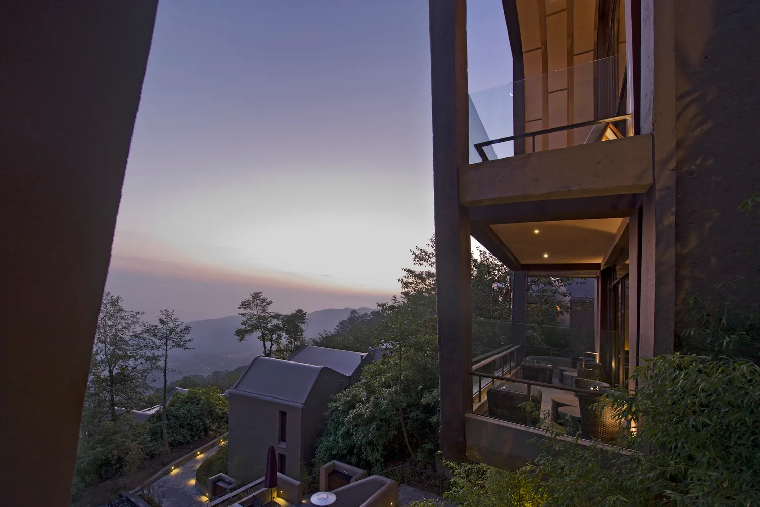 Modern residential veranda featuring wood, glass, and metal elements.