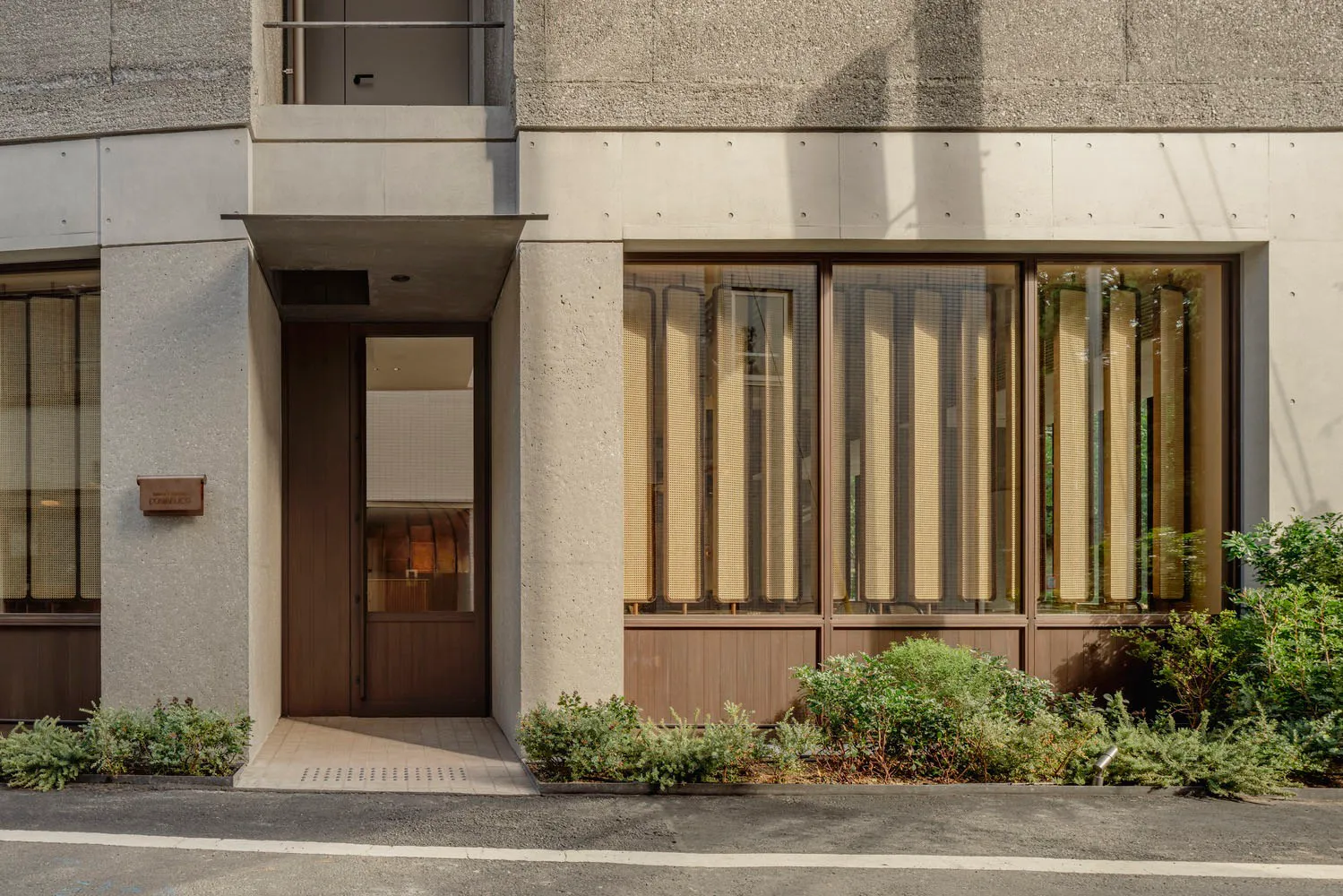 A modern retail storefront with a glass exterior.