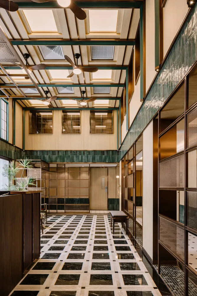 A contemporary lobby space with marble flooring and modern design elements.