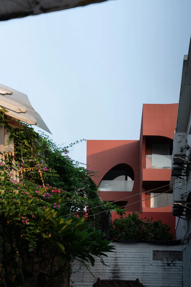 Modern residential building with concrete exterior.