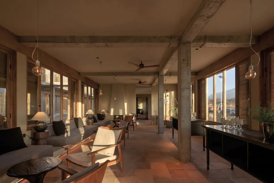 A modern interior design featuring concrete, glass, and concrete surfaces.