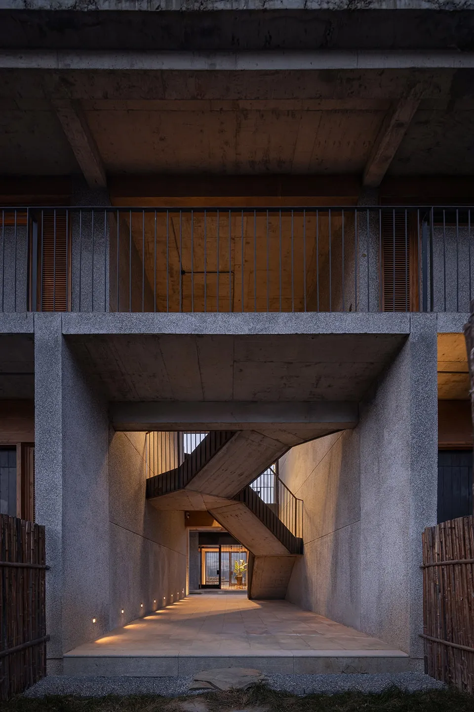 A modern architectural staircase made of concrete materials, featuring minimalist design and sleek lines.