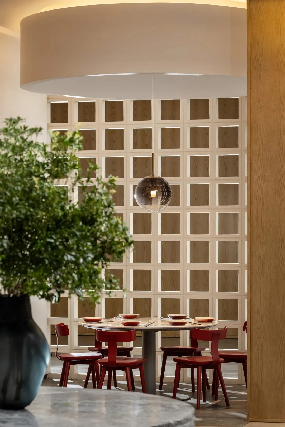 An industrial-style restaurant interior featuring wooden elements and a modern design.