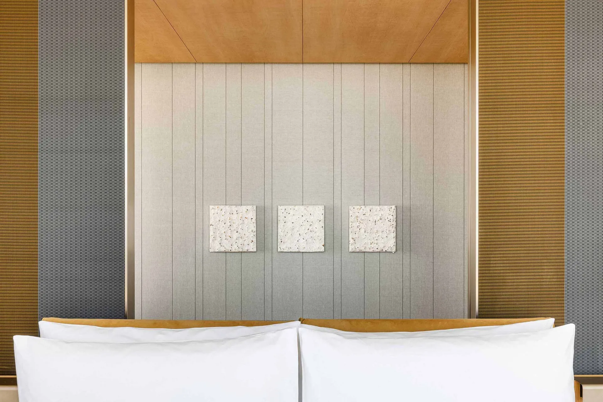 Minimalist bedroom with fabric and wood materials