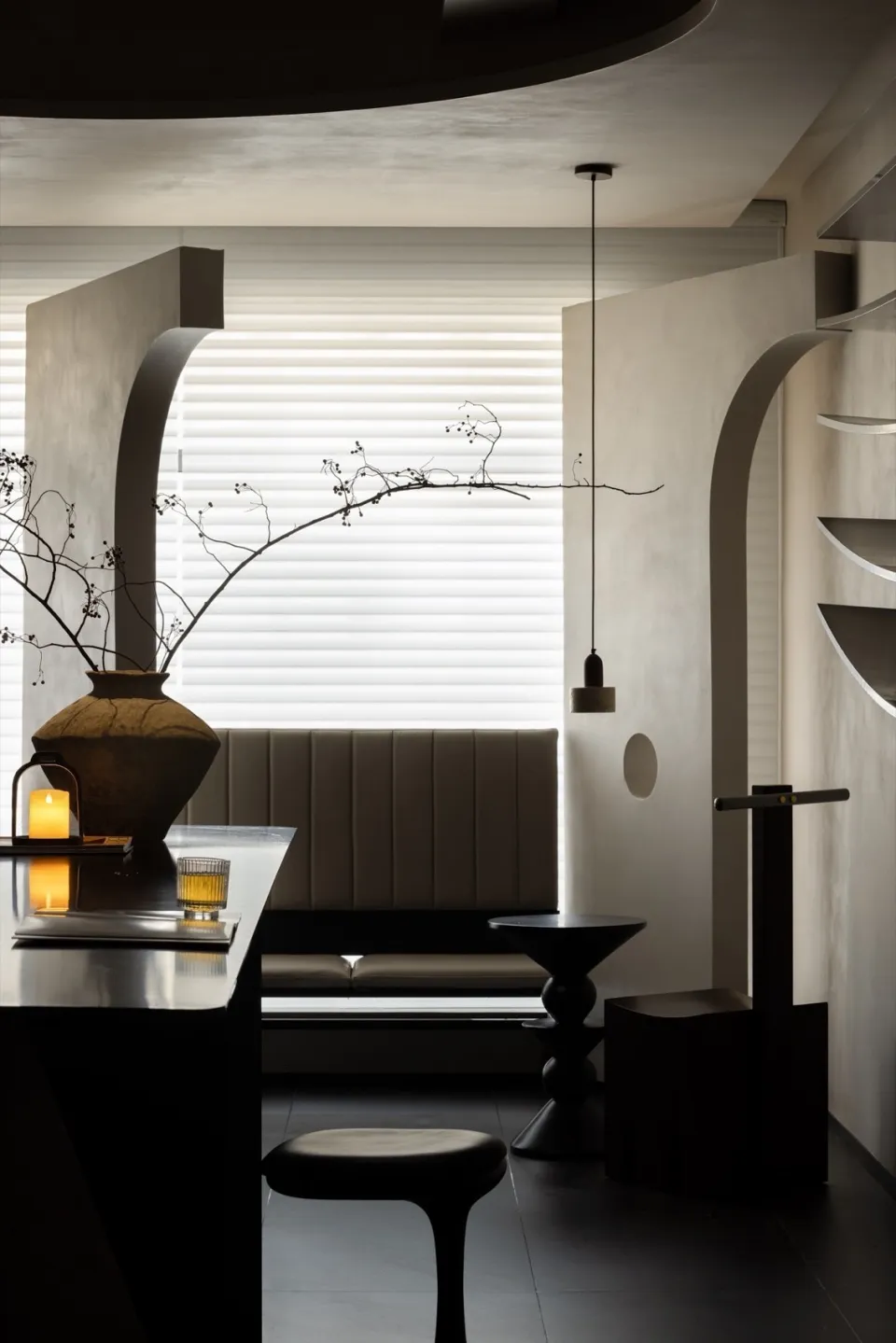 Modern interior design featuring concrete walls and minimalist furniture.