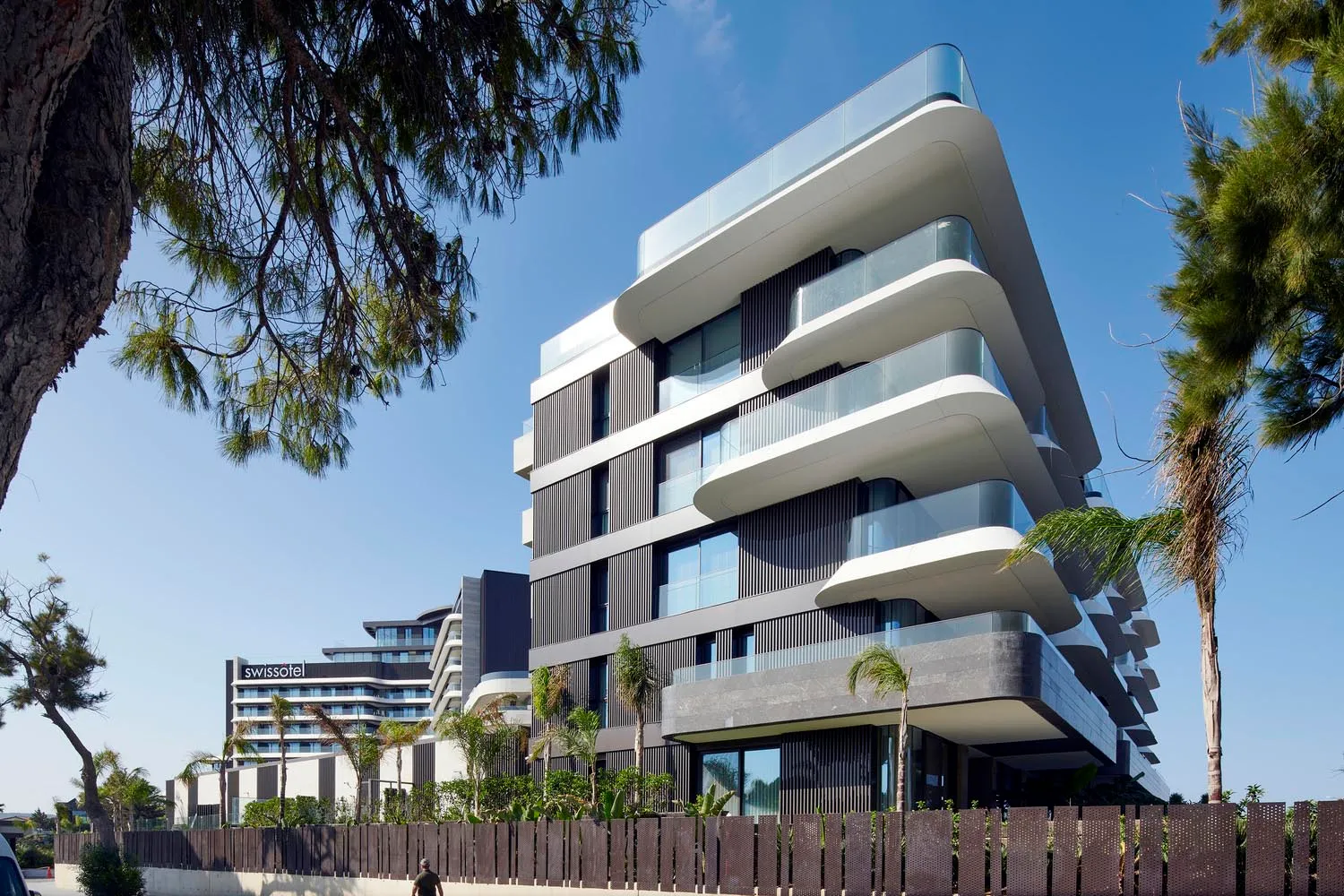 Modern apartment buildings with glass and concrete exteriors