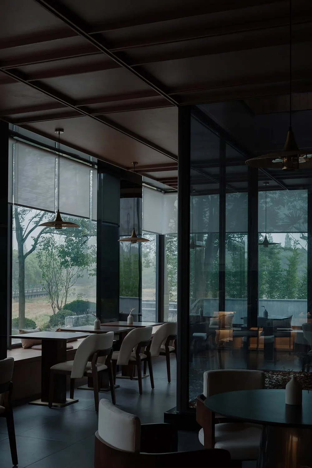 Modern cafe interior with glass and concrete materials