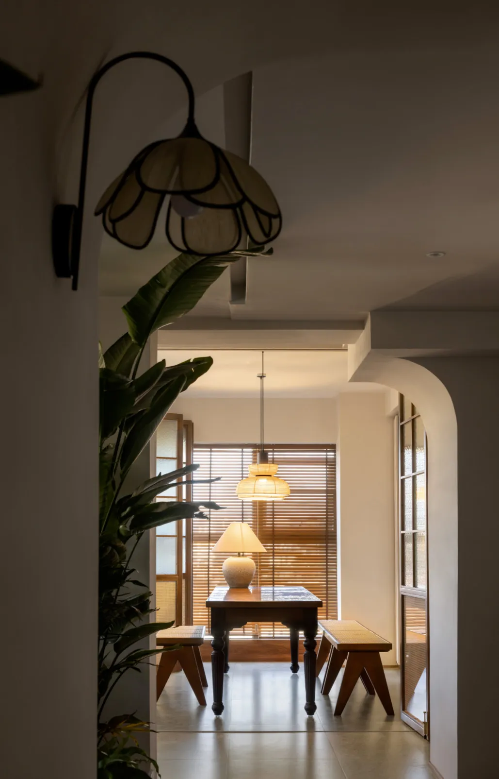 A modern dining room features wooden furniture with sleek, minimalist designs.