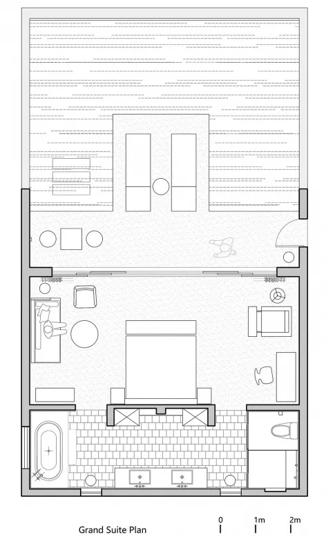 豪華套房平面圖,展示臥室及附屬衛浴,標示家具與固定設施。