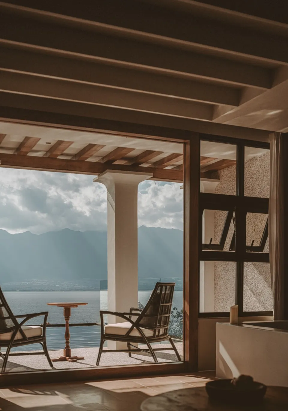 A modern residential interior featuring wood and concrete elements.