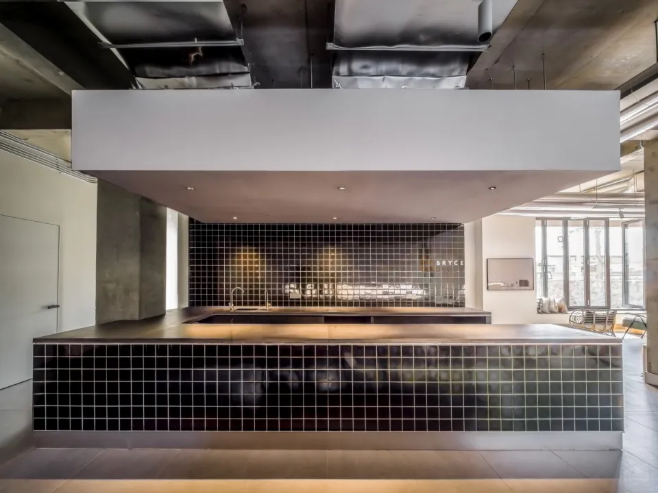 A modern kitchen featuring metallic finishes and sleek design.