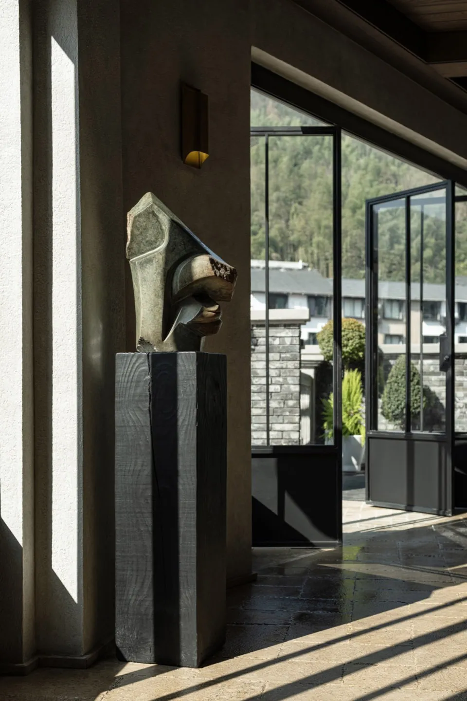 A modern sculpture made of marble in a contemporary setting.