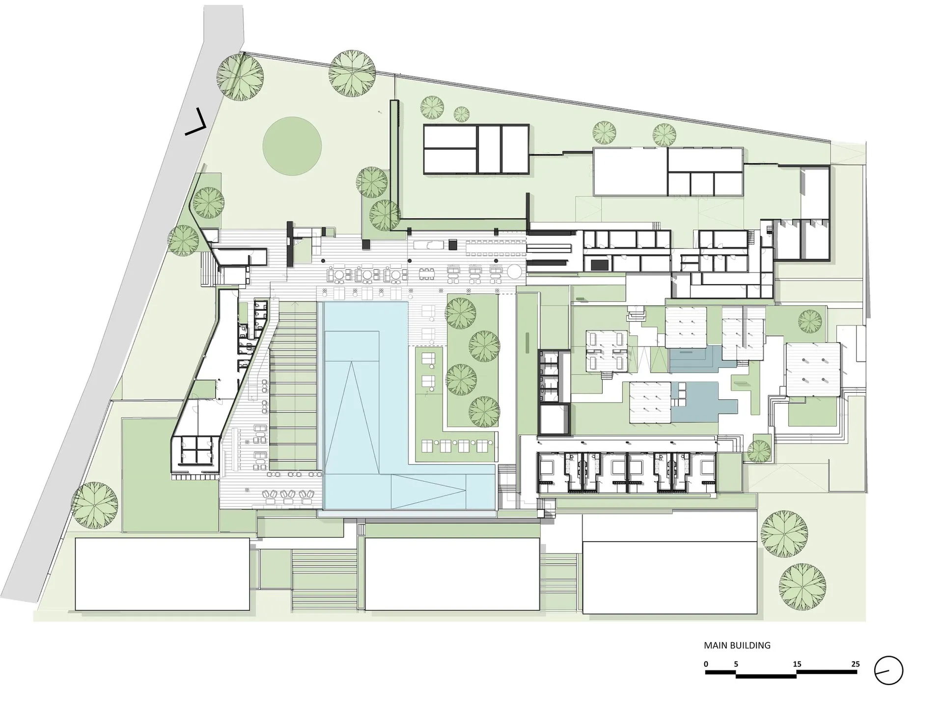 Floor plan of a residential compound featuring multiple buildings, green spaces, and outdoor amenities.