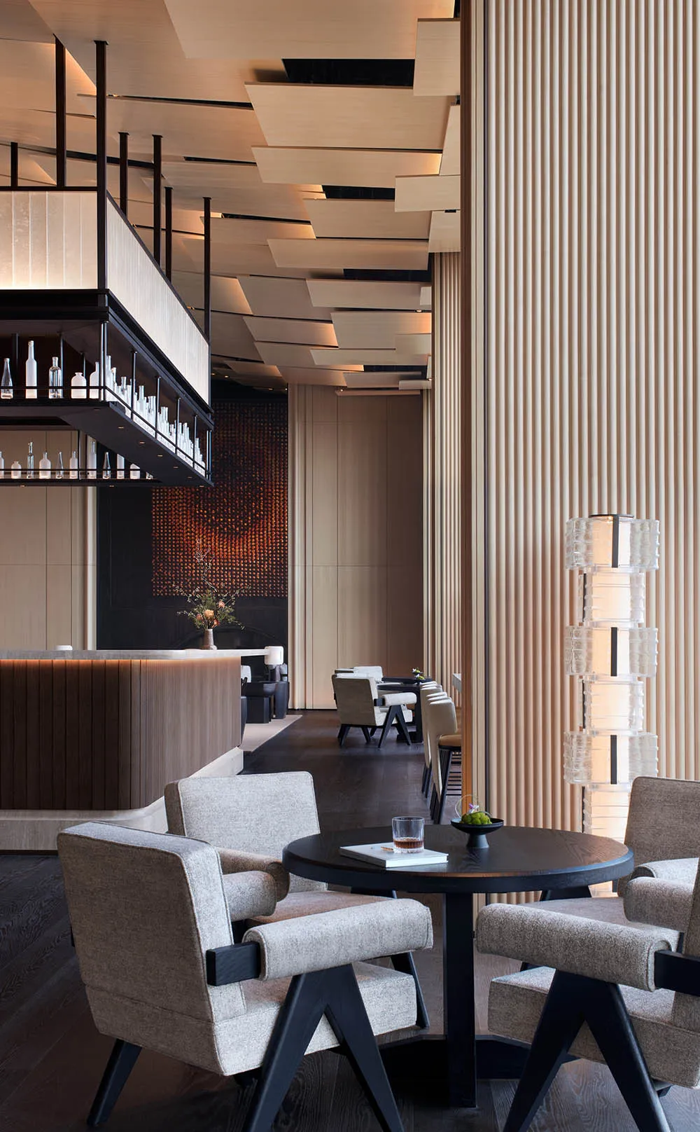 A modern restaurant bar featuring wooden design elements.