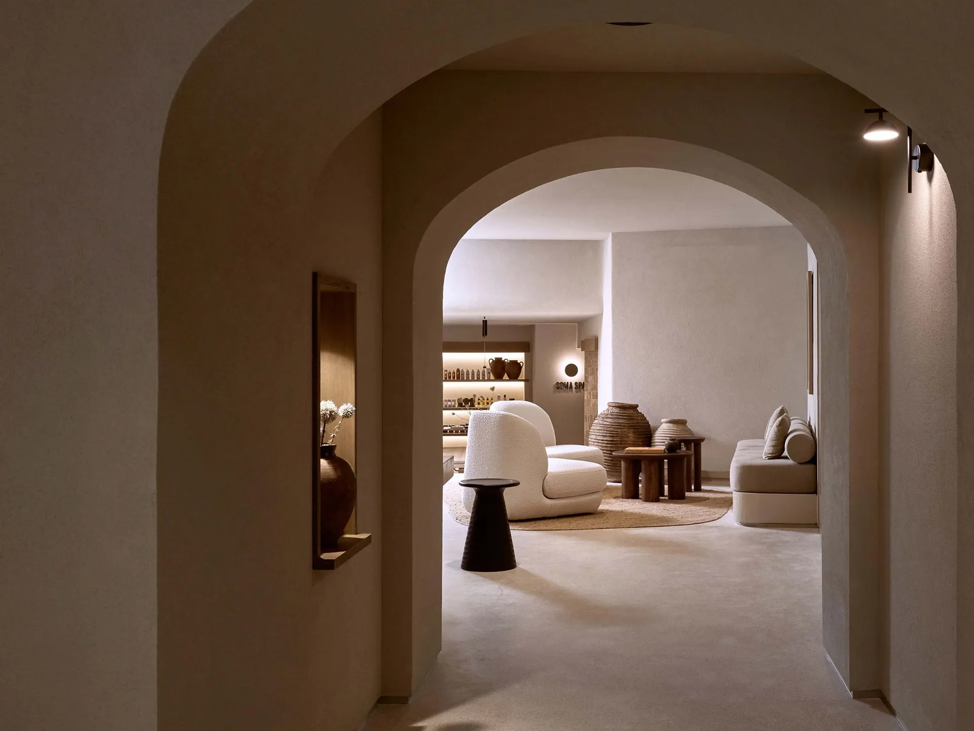A modern spa interior with minimalist design and concrete walls and floors.