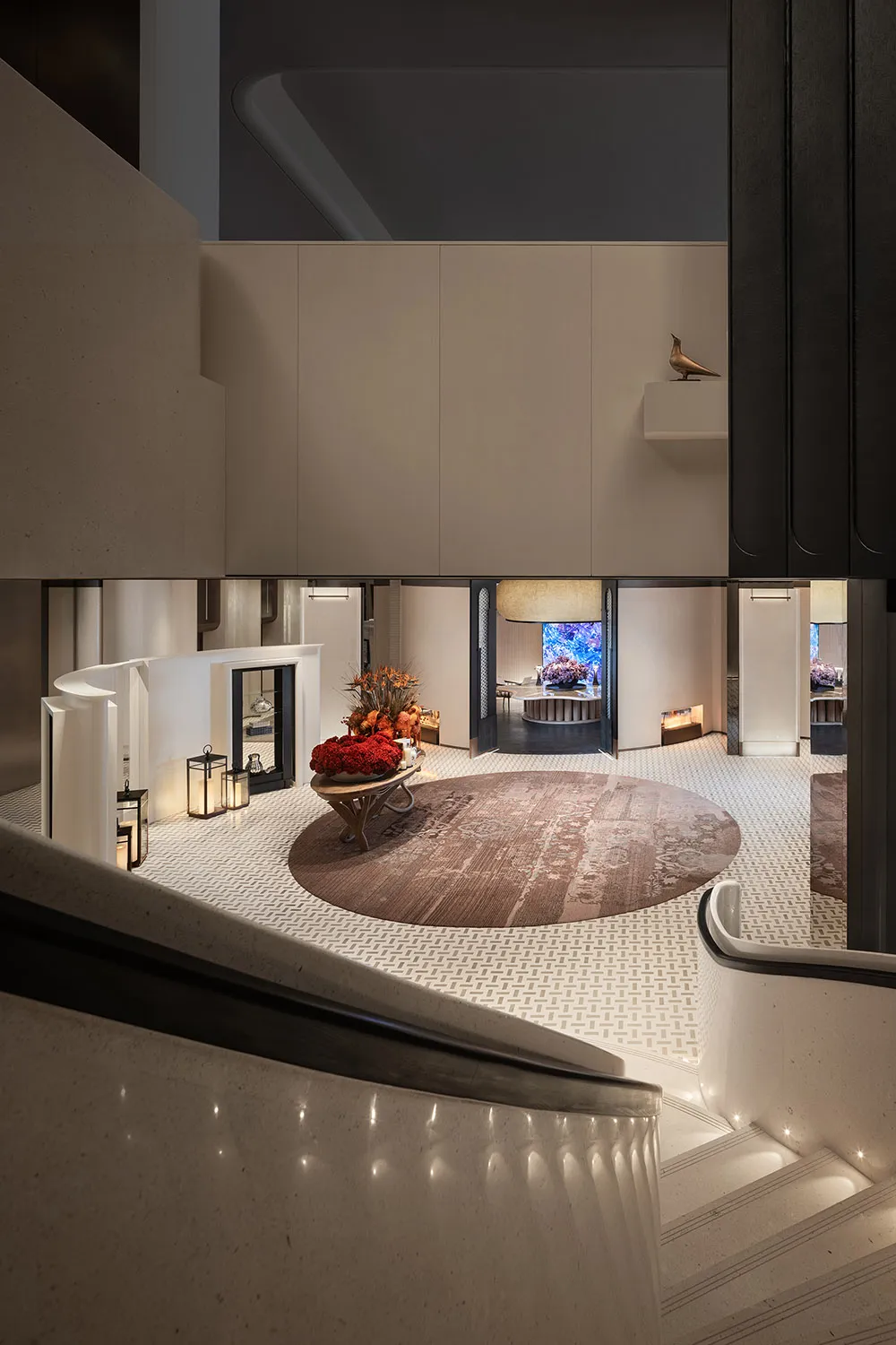 Modern lobby featuring marble floors and concrete accents