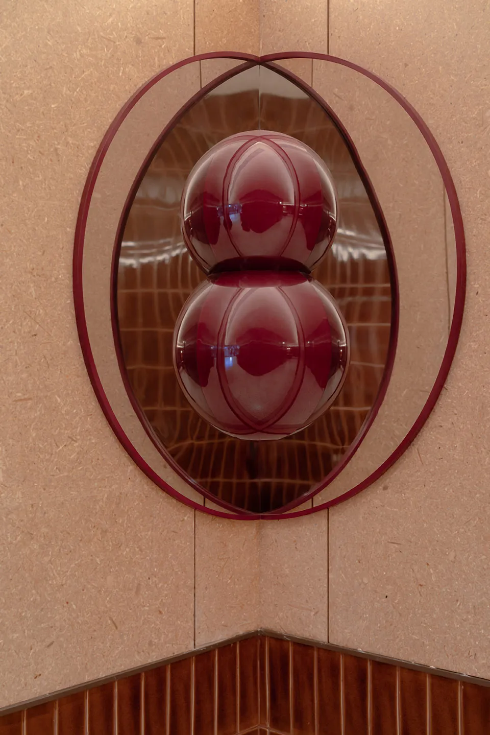 A minimalist glass artwork in a modern interior setting
