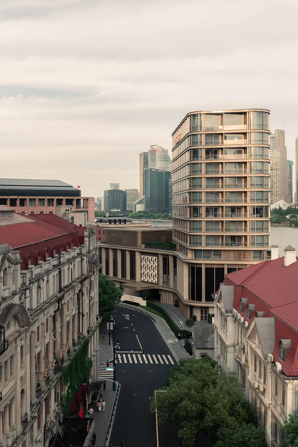 A modern cityscape featuring tall buildings constructed with glass, concrete, and steel.